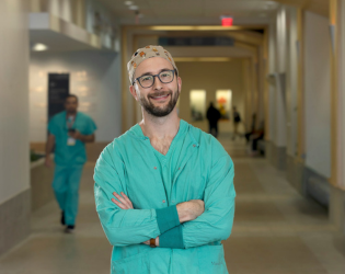 Anesthesiologist Dr. Parker Merrill standing in a hallway at MaineHealth Maine Medical Center Portand