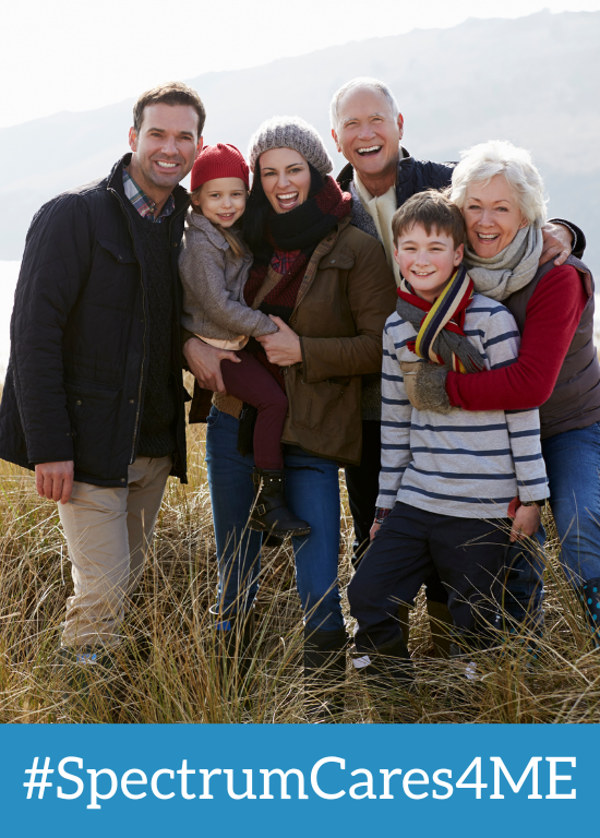 Family walking on dunes at beach in early spring